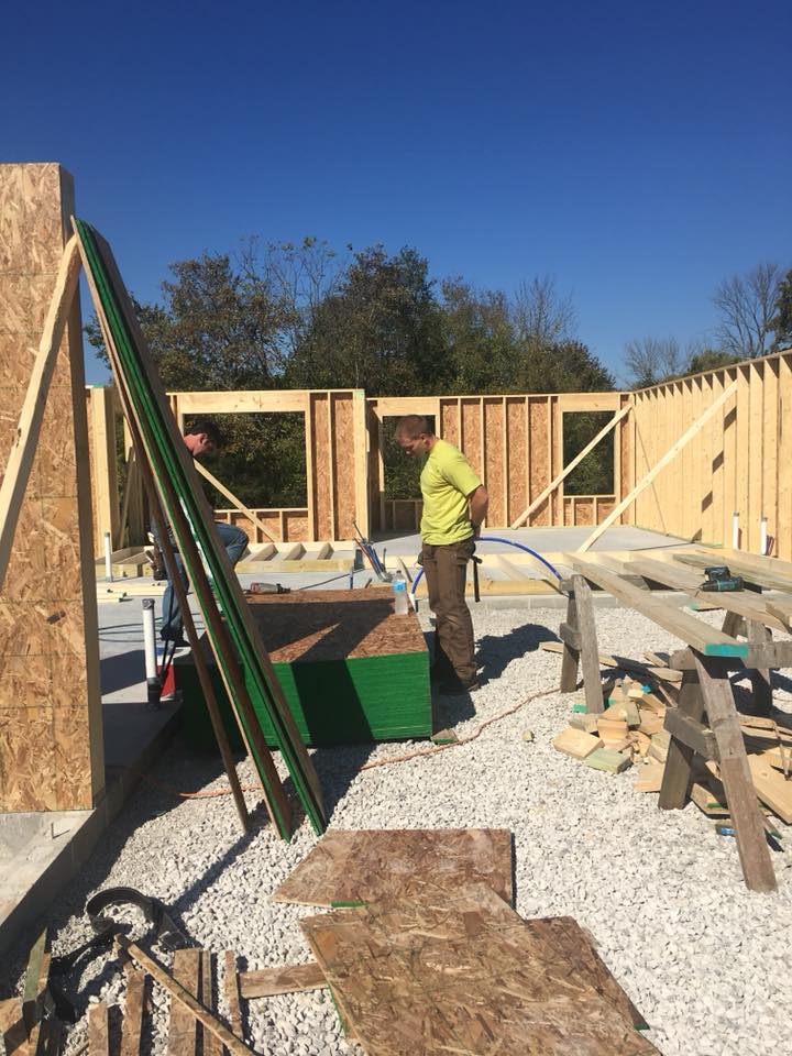 Man checking works in site — Construction Company in Bloomington, IN