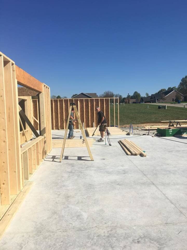 Workers preparing construction materials — Construction Company in Bloomington, IN