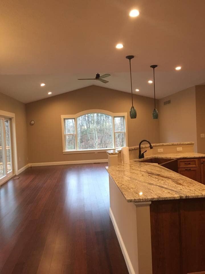 Shiny flooring at empty room — Construction Company in Bloomington, IN