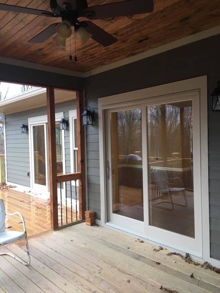 New wood deck with glass door — Construction Company in Bloomington, IN