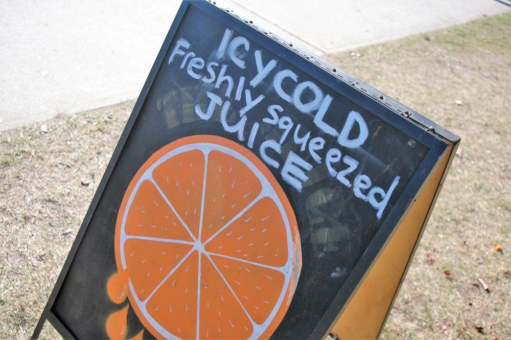 fresh orange juice stall signage