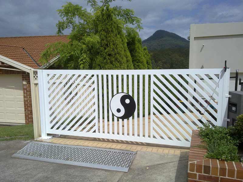 White gate with a yin yang symbol — Balustrading in Unanderra NSW