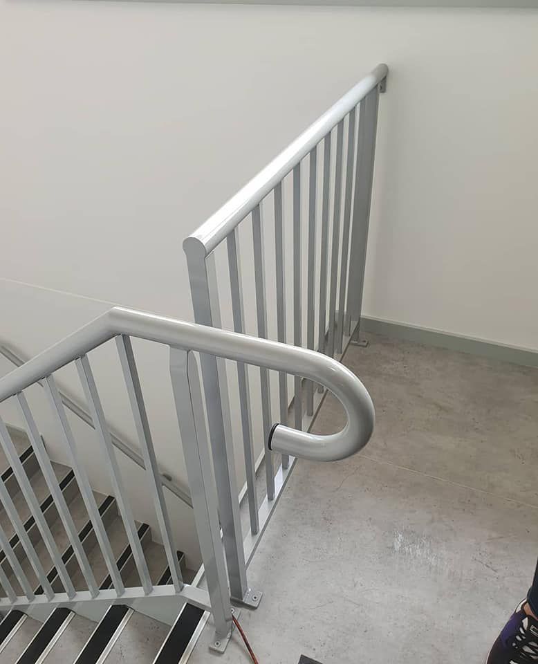 Staircase with a metal railing with lock — Balustrade in Bulli NSW