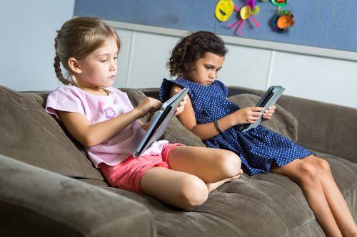 Two Girls Using Tablets — Darwin, NT — Territory Child Care Group