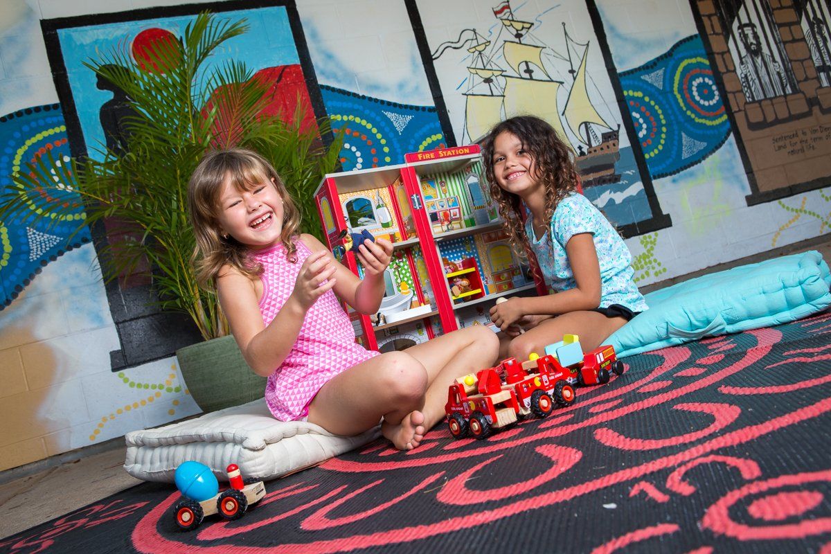 Two Girls Playing Truck Toys — Darwin, NT — Territory Child Care Group