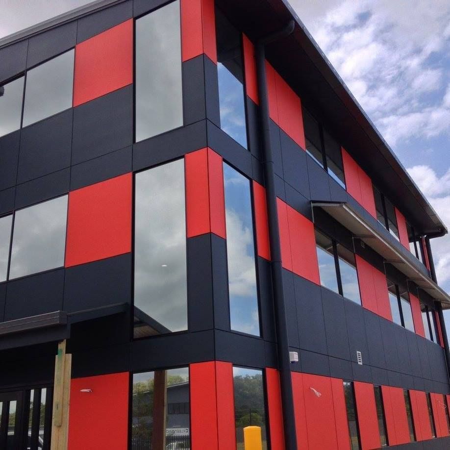 A red and black building with a lot of windows — TSR Tinting & Frosting In Caloundra West, QLD