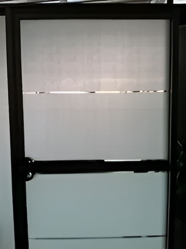 A Door With Frosted Glass And A Black Frame — TSR Tinting & Frosting In Caloundra West, QLD