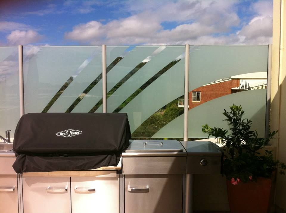 A stainless steel grill with a black cover on it — TSR Tinting & Frosting In Caloundra West, QLD