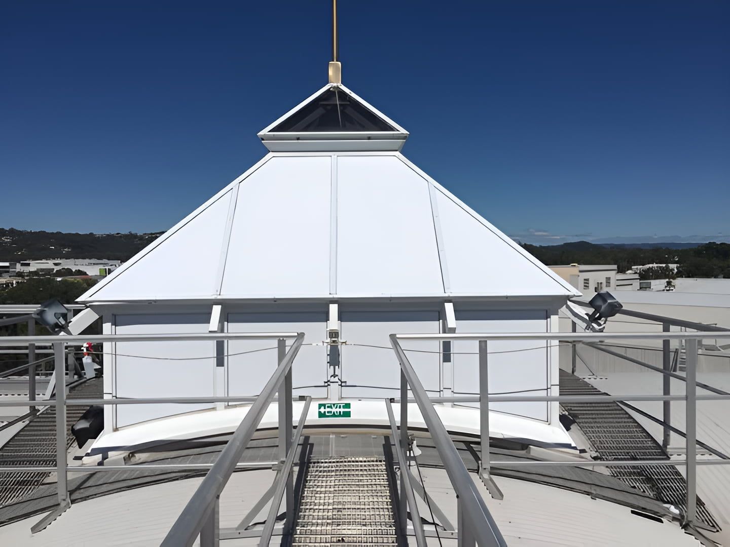 A White Building With A Staircase Leading Up To It — TSR Tinting & Frosting In Caloundra West, QLD