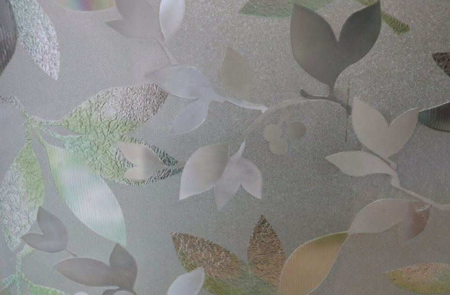 A Close Up of a Stained Glass Window With Leaves on It — TSR Tinting & Frosting In Caloundra West, QLD