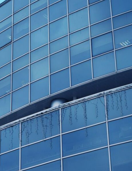 A Building With a Lot of Windows and Icicles on the Windows — TSR Tinting & Frosting in Noosa, QLD