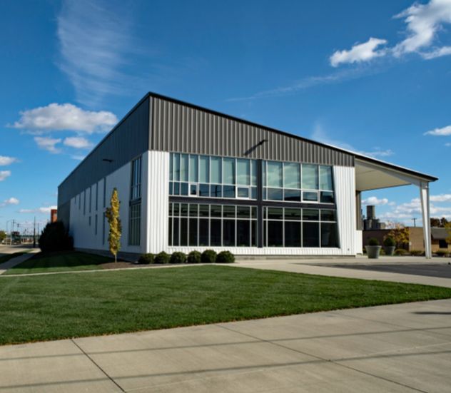 A Large Building With a Lot of Windows and a Bridge in Front of It — TSR Tinting & Frosting in Caloundra, QLD