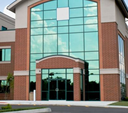 A Large Brick Building With a Lot of Windows — TSR Tinting & Frosting in Maroochydore, QLD