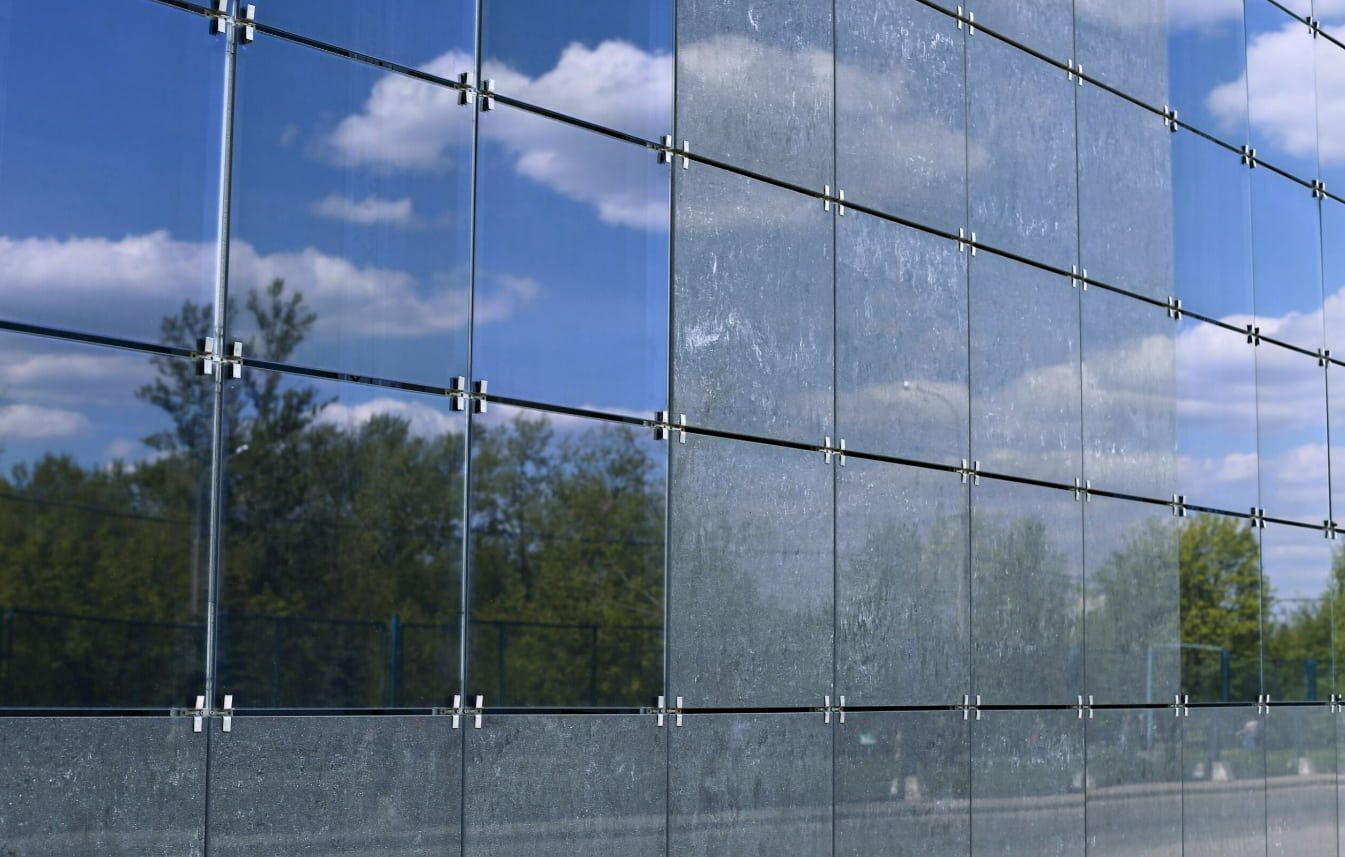 A Building With a Blue Sky Reflected in the Windows — TSR Tinting & Frosting in Maroochydore, QLD