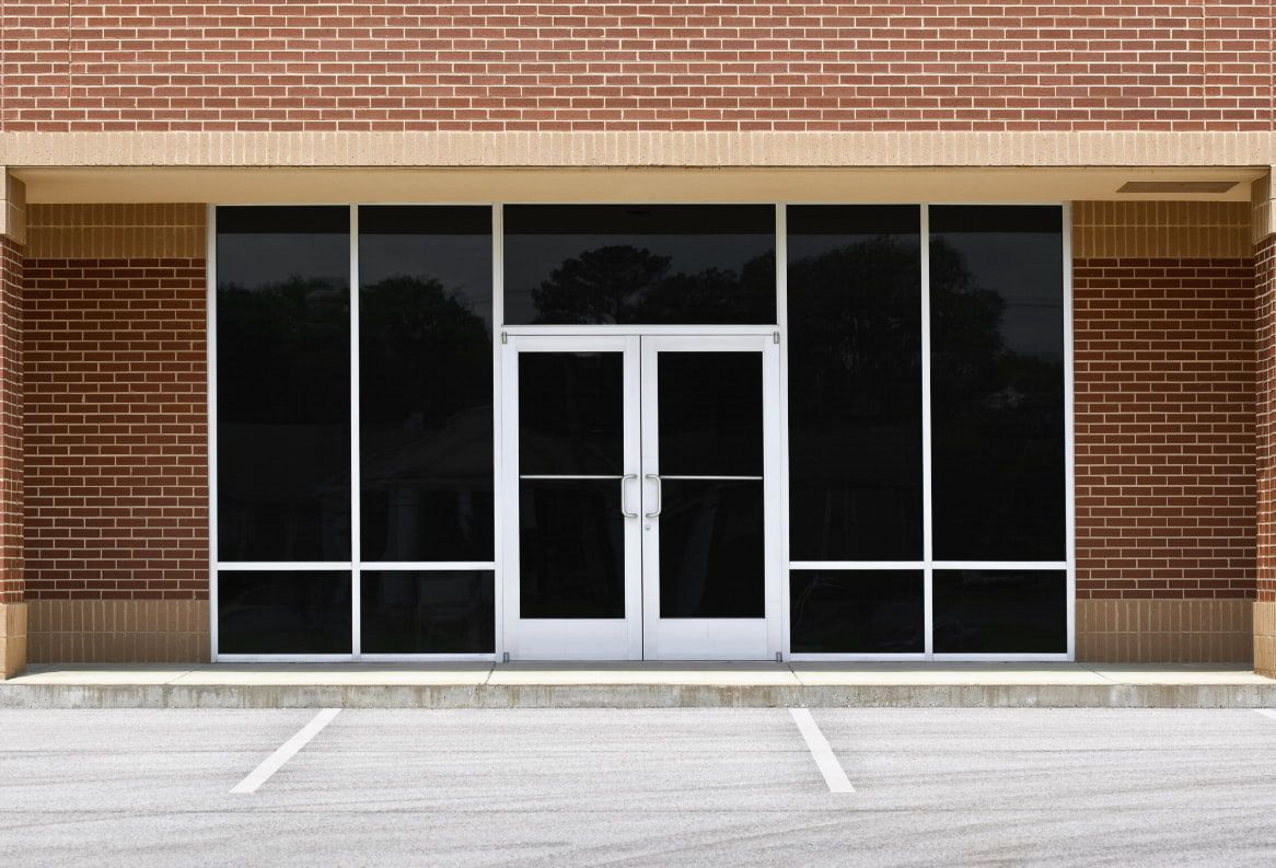 A Building With a Blue Sky Reflected in the Windows — TSR Tinting & Frosting in Maroochydore, QLD