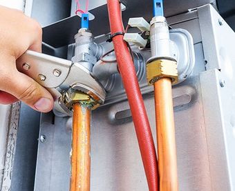 Plumber Repairing a Gas Boiler — Martinez, CA — Ernie’s Plumbing & Sewer Service
