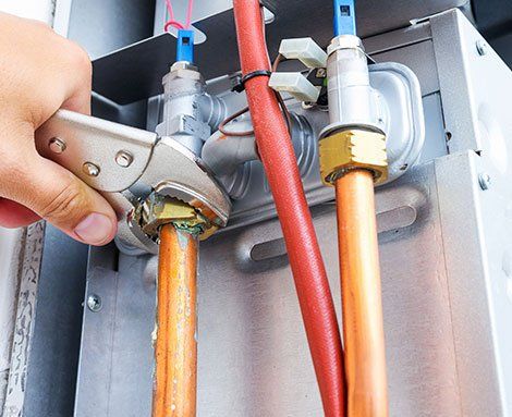 Plumber Repairing a Gas Boiler — Martinez, CA — Ernie’s Plumbing & Sewer Service
