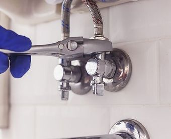 Plumber Holding Wrench — Martinez, CA — Ernie’s Plumbing & Sewer Service