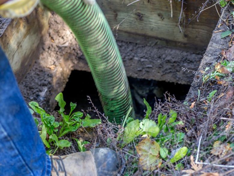 Worker Emptying Septic — Martinez, CA — Ernie’s Plumbing & Sewer Service