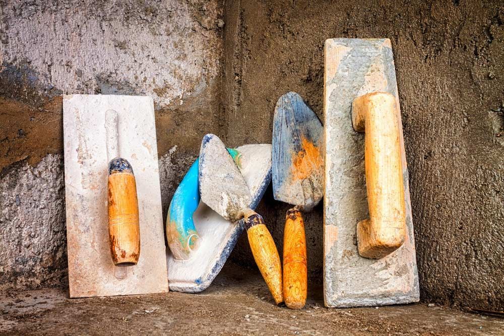 A Group Of Tools Sitting On Top Of A Concrete Surface — TP Concreting In Warilla, NSW