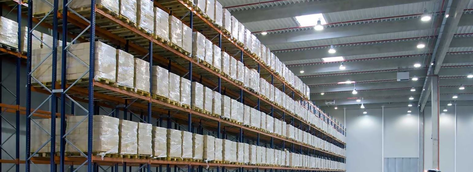 Long warehouse shelves with pallets full of boxes