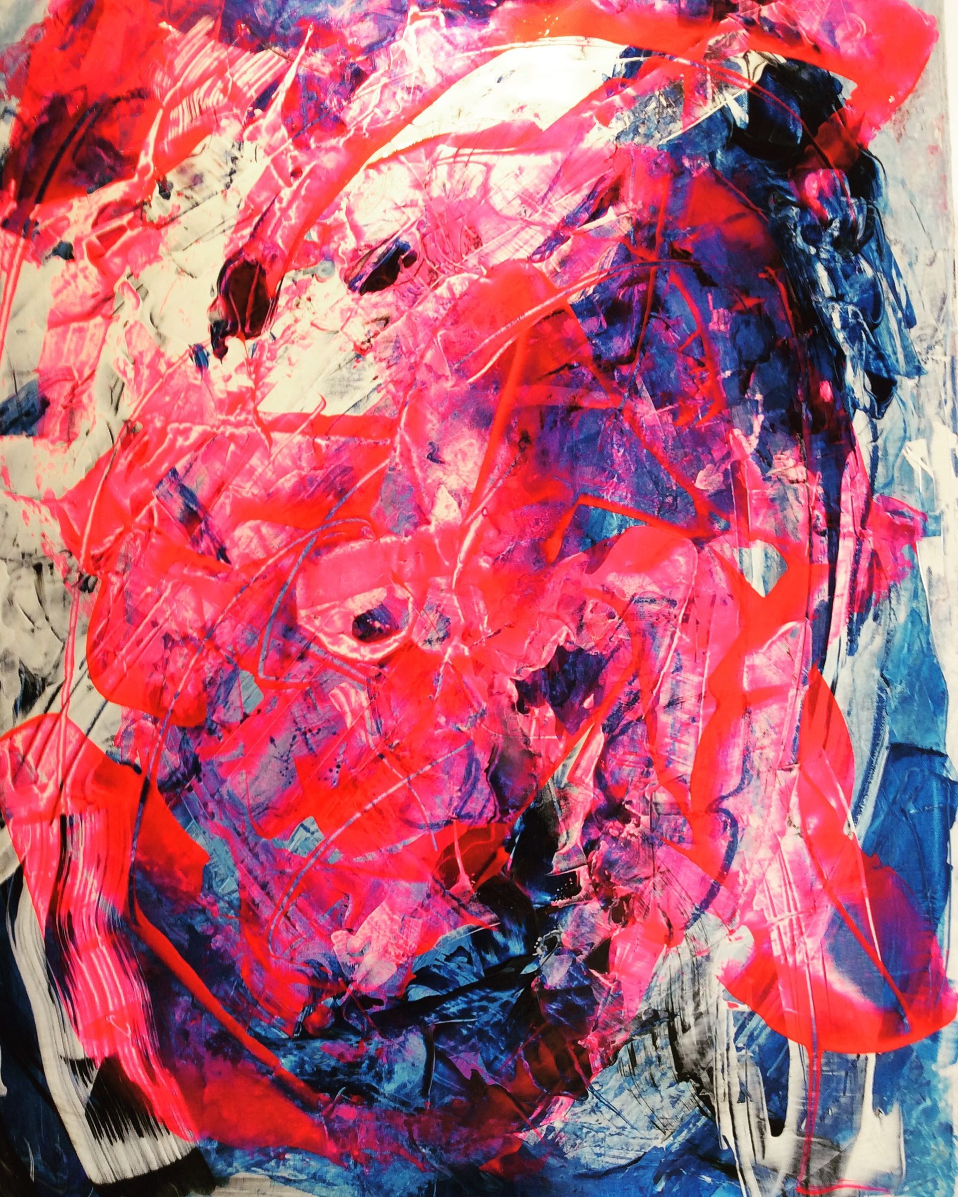 A close up of a painting with pink and blue colors