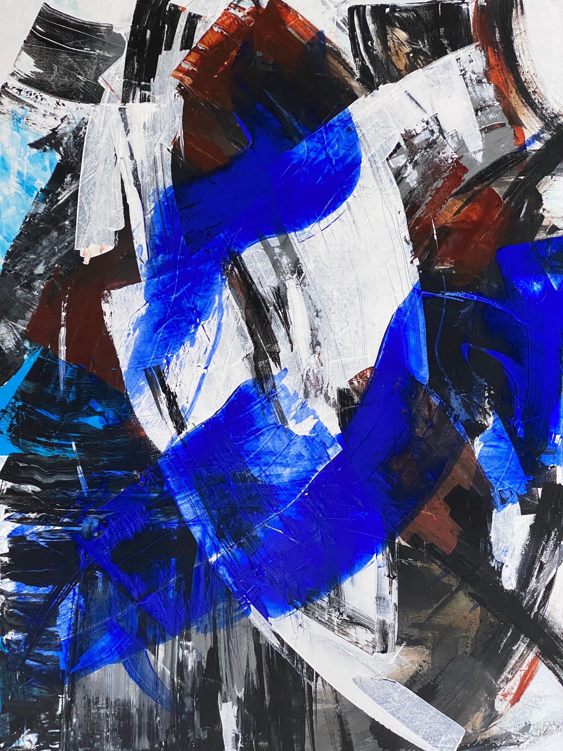A close up of a painting with blue and white paint
