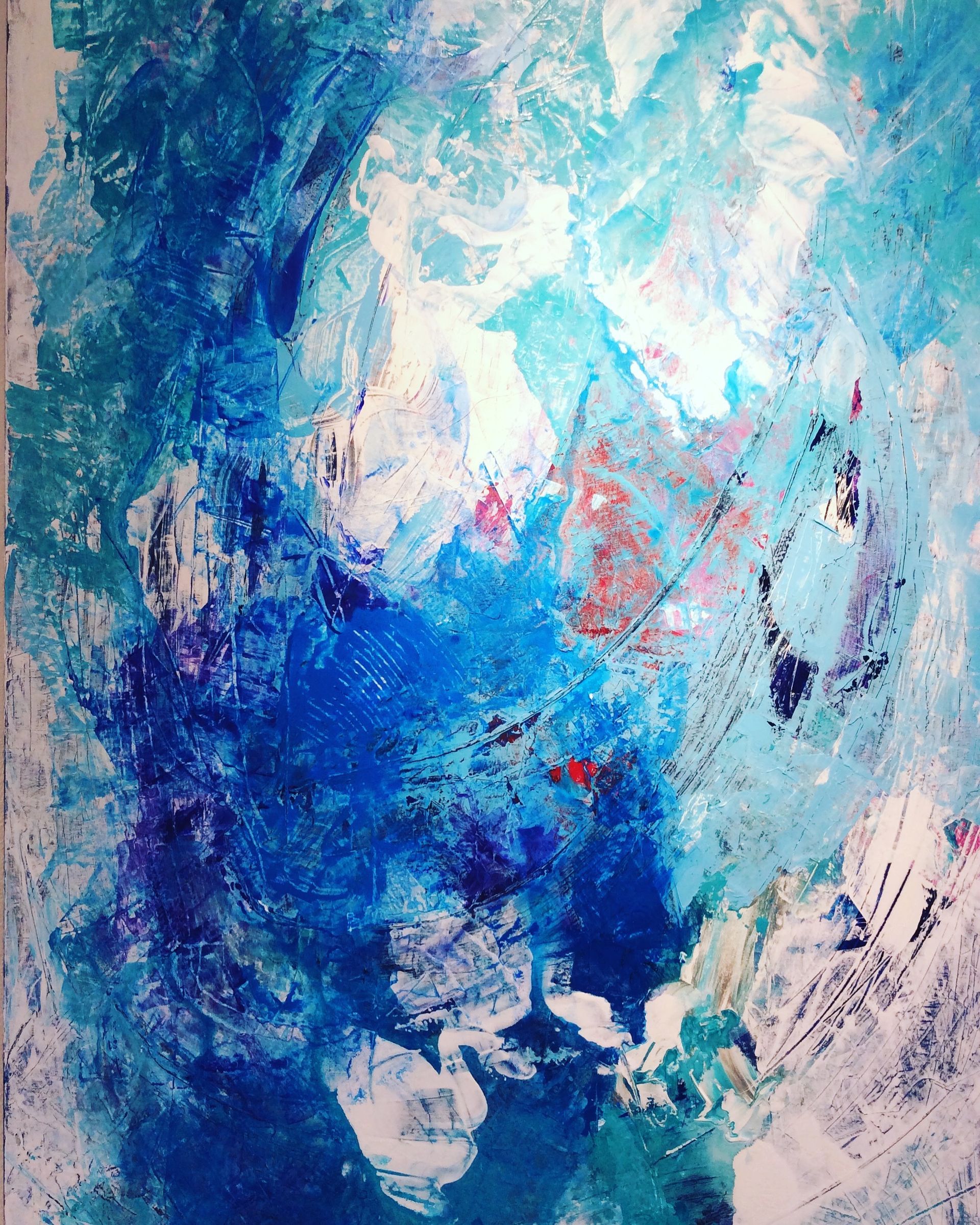 A close up of a blue and white painting on a wall.