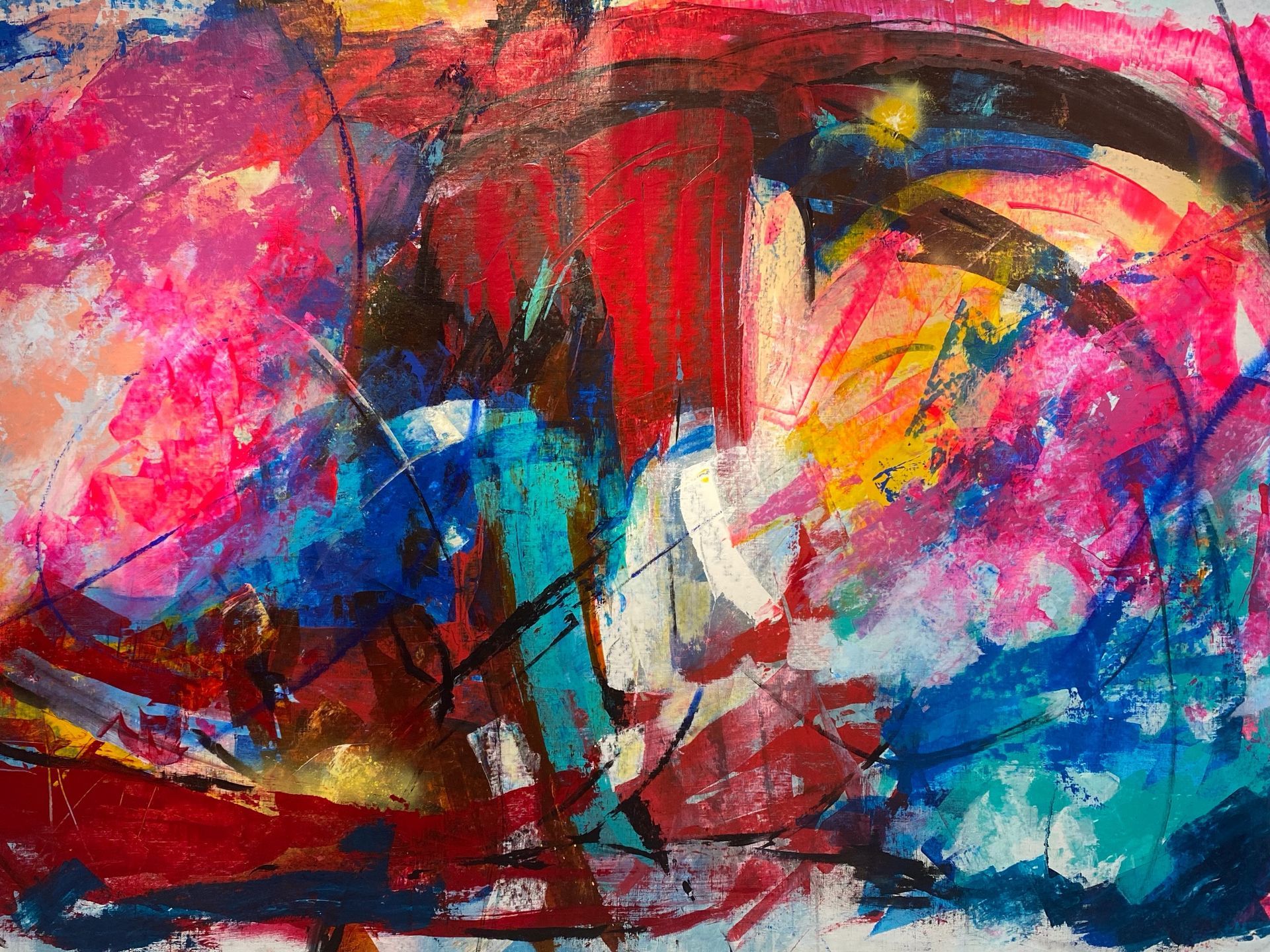 A close up of a colorful painting on a wall.