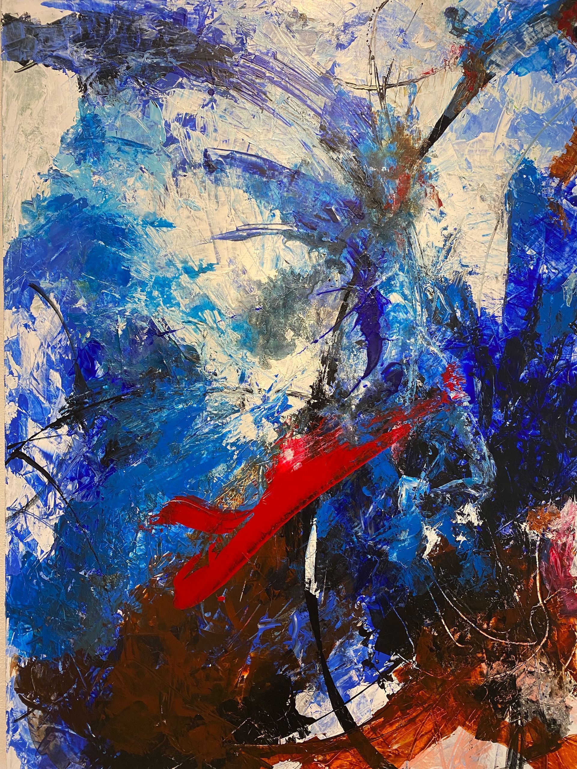 A close up of a colorful painting with a red feather in the middle.