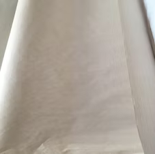A close up of a white cloth on a table.