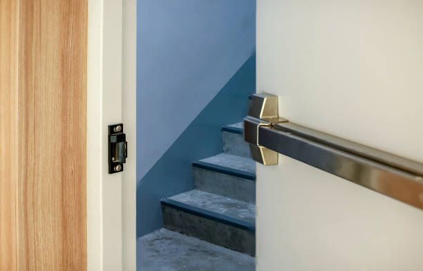 Commercial locksmith services represented on an emergency exit door with crash bar for safety.