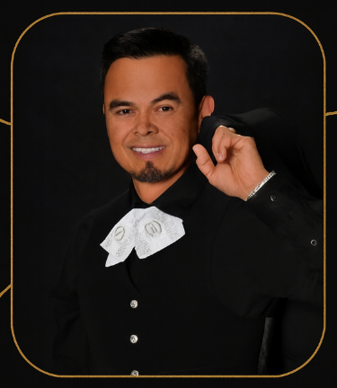 Mariachi band playing guitars on a cobblestone street with colorful buildings. Mariachi band playing guitars on a cobblestone street with colorful buildings.