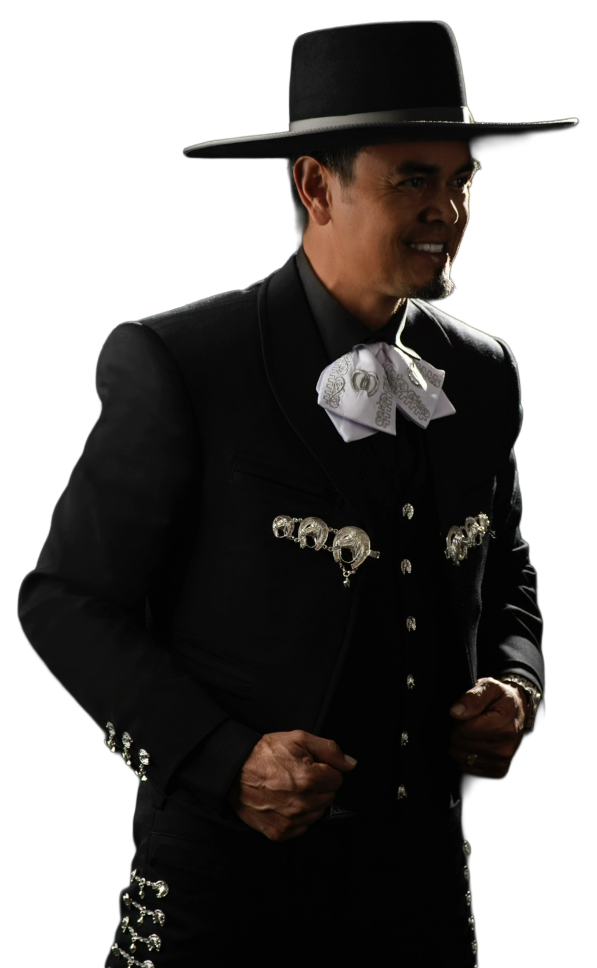 Man in a black charro suit with a wide-brimmed hat, smiling.