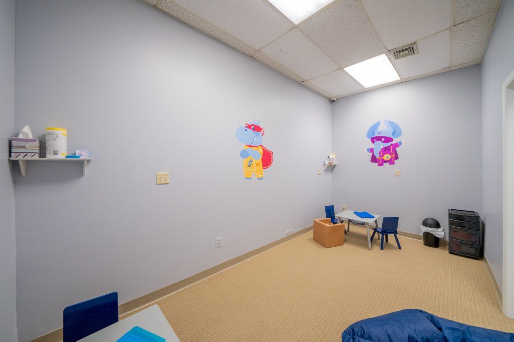 There is a table and chairs in the room.