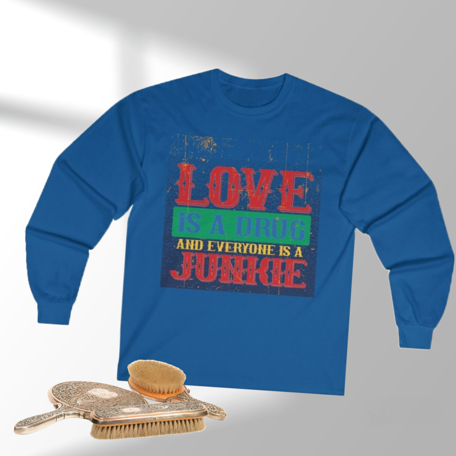 Blue long-sleeve shirt with a graphic that says 