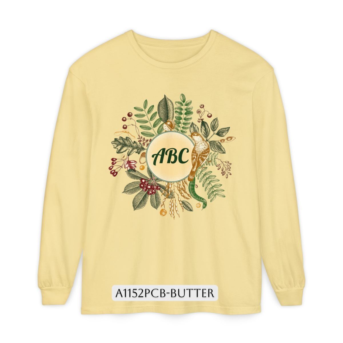 Yellow long-sleeved shirt with a floral wreath and "ABC" in a central circle.