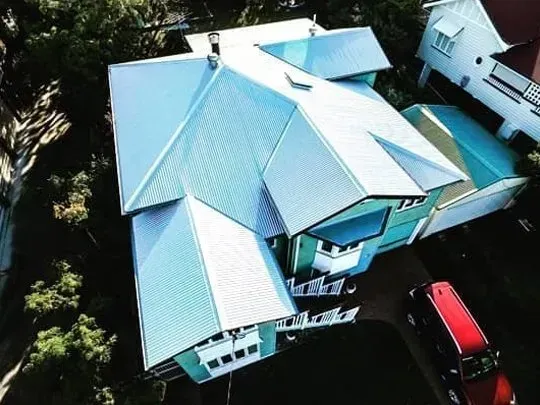 An aerial view of a white roof of a house.