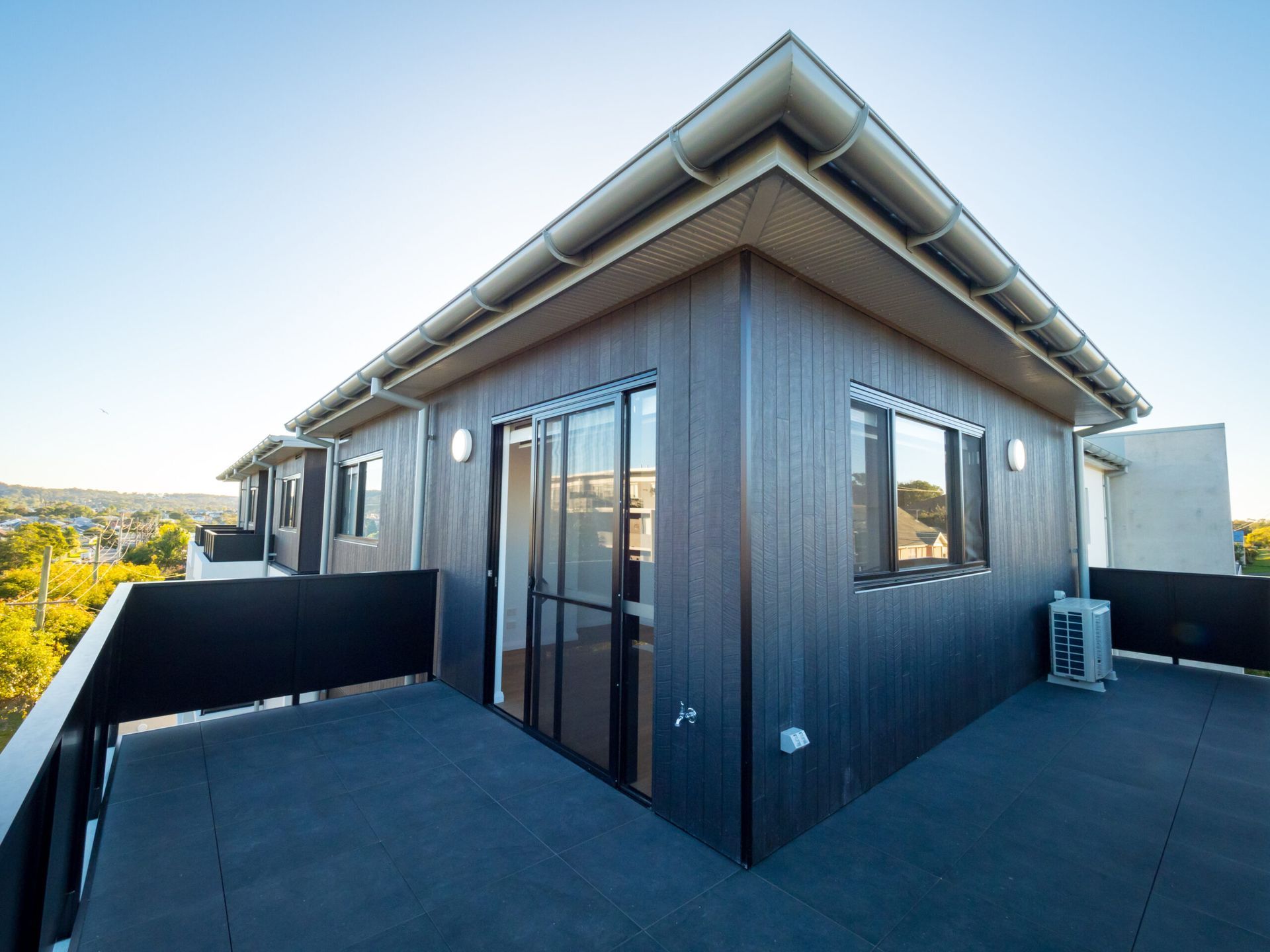 A house with a balcony and a lot of windows
