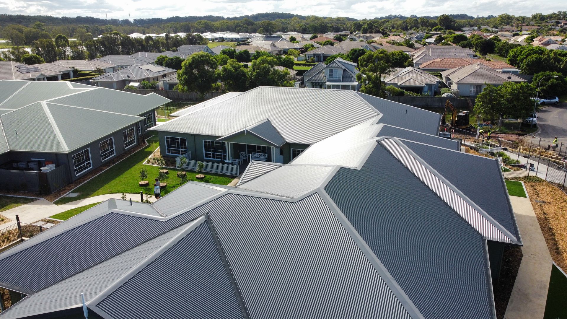 An aerial view of a residential area with lots of houses and trees.