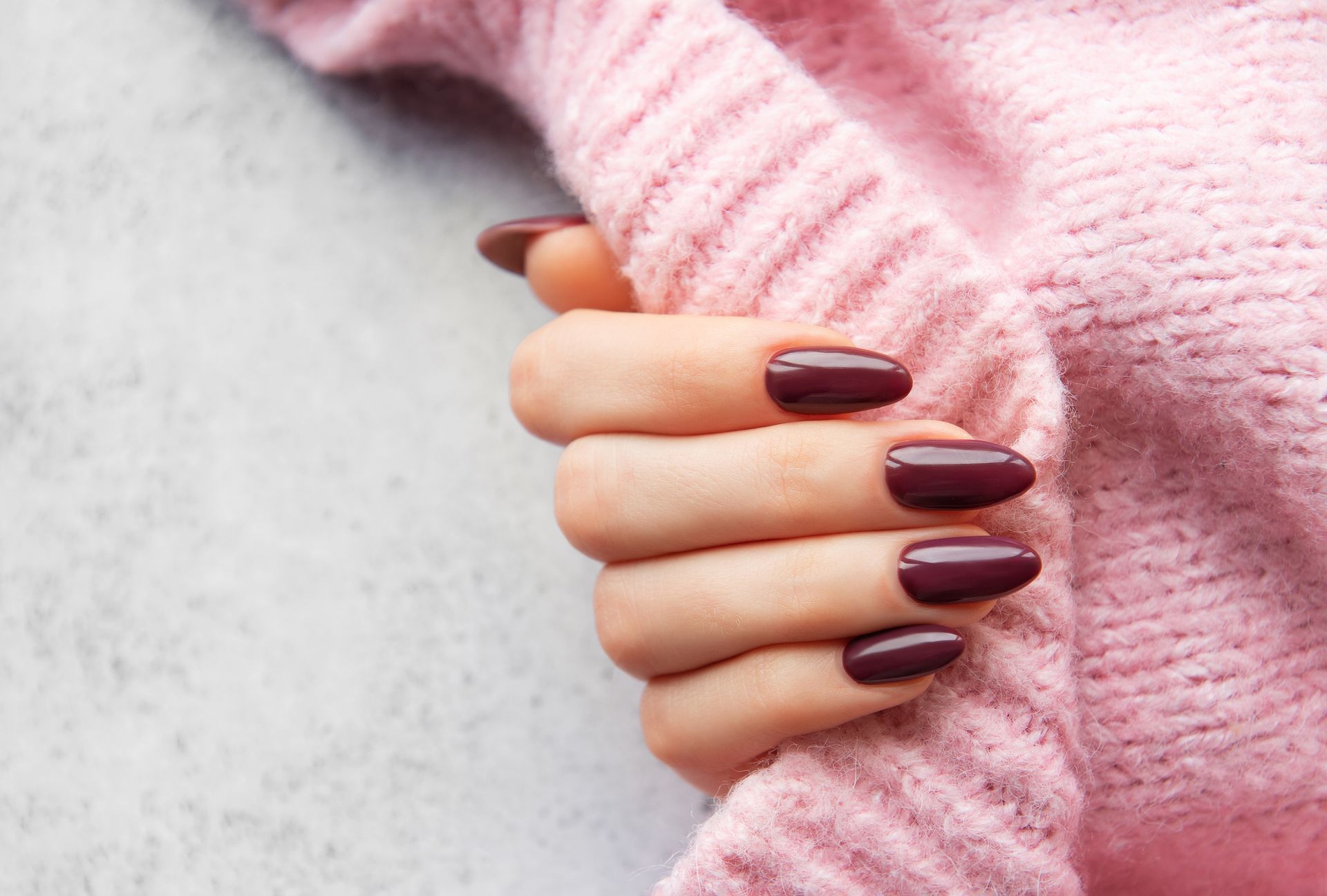 Closeup of a Woman Hand Showing Her Red Painted Nails