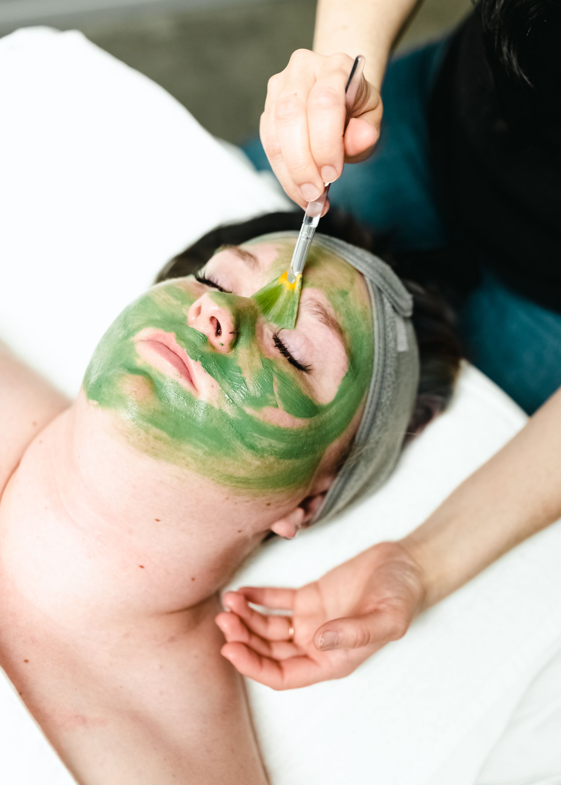 A young woman getting a European facial at a beauty spa A young woman getting a European facial at a beauty spa