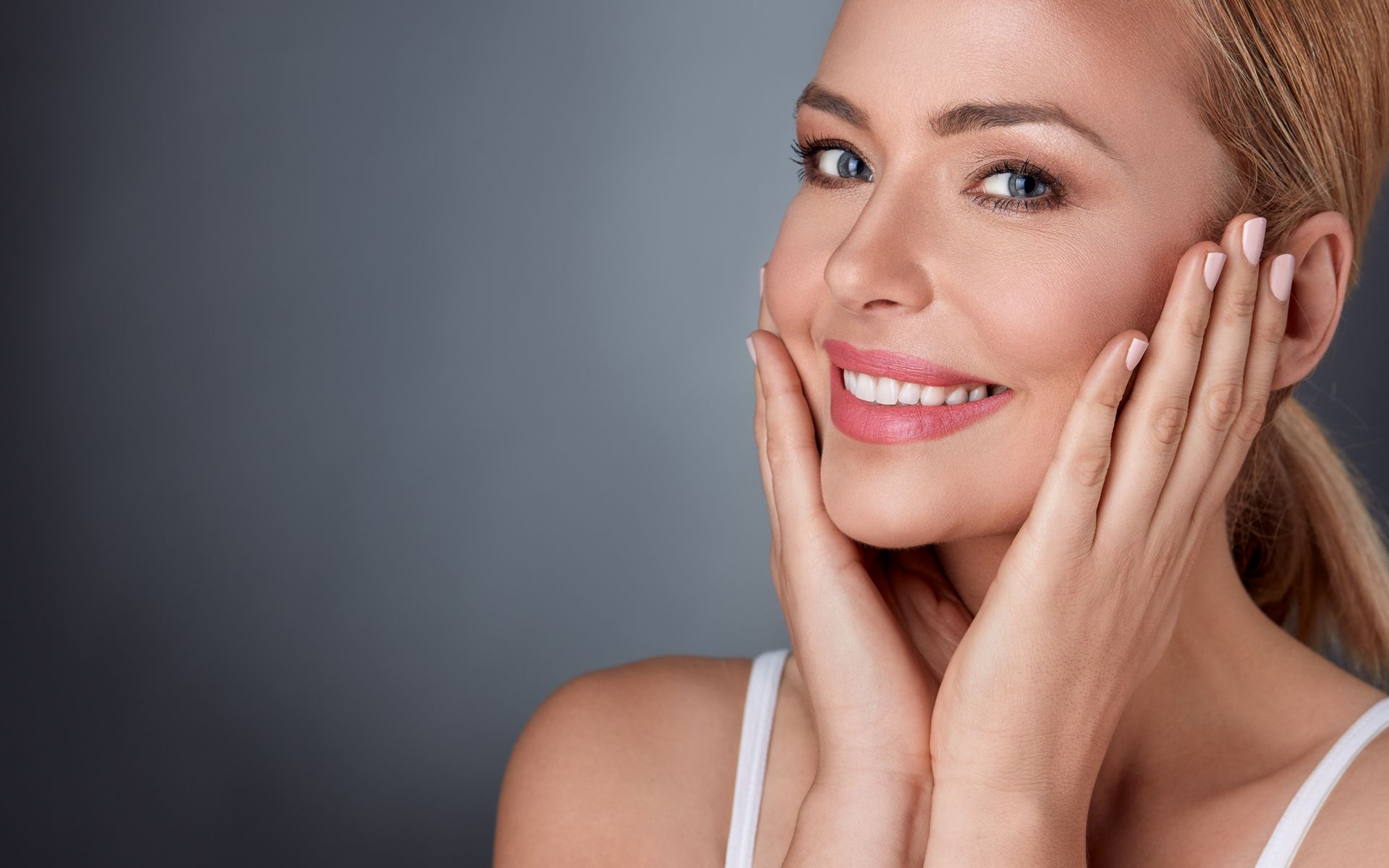 Picture of a woman showing her face after getting a facial spa treatment