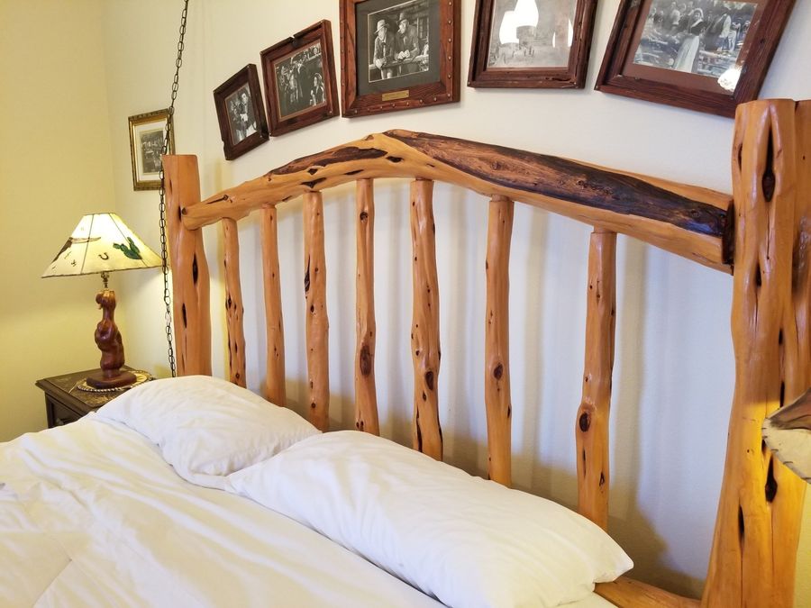 Log headboard with bed
