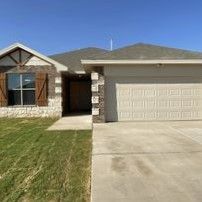 The front of a house with a garage and a driveway.