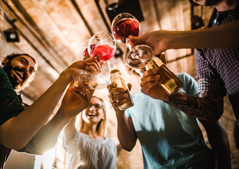 Happy Friends Toasting With Alcohol Drinks — Gilbert, AZ — Tap Dragon Craft Been & Wine Bar