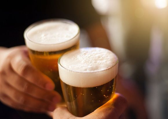 Hands Holding Beer Glasses — Gilbert, AZ — Tap Dragon Craft Been & Wine Bar