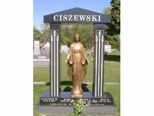 Monument with a statue of a woman inside a black and white frame, 