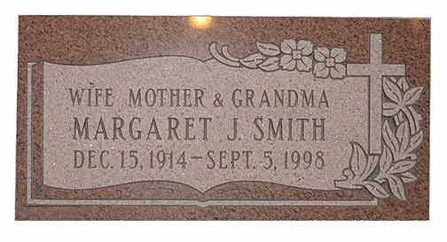 Gravestone of Margaret J. Smith, with birth/death dates and family roles.