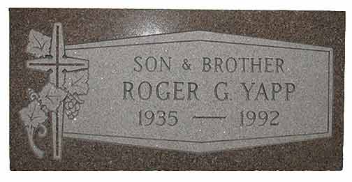 Gravestone of Roger G. Yapp, with cross and grape leaves. Dates: 1935-1992. Text: 
